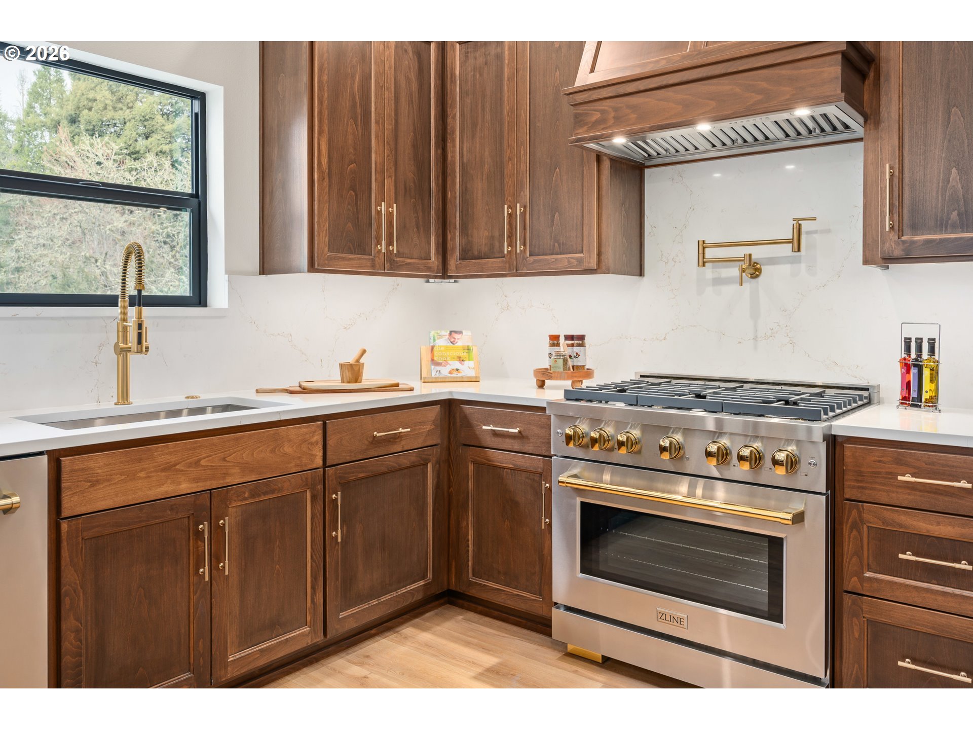 4835 Elva Lane Eugene, OR 97405 - Photo 14 of 48 a kitchen with stainless steel appliances wooden cabinets and a stove top oven