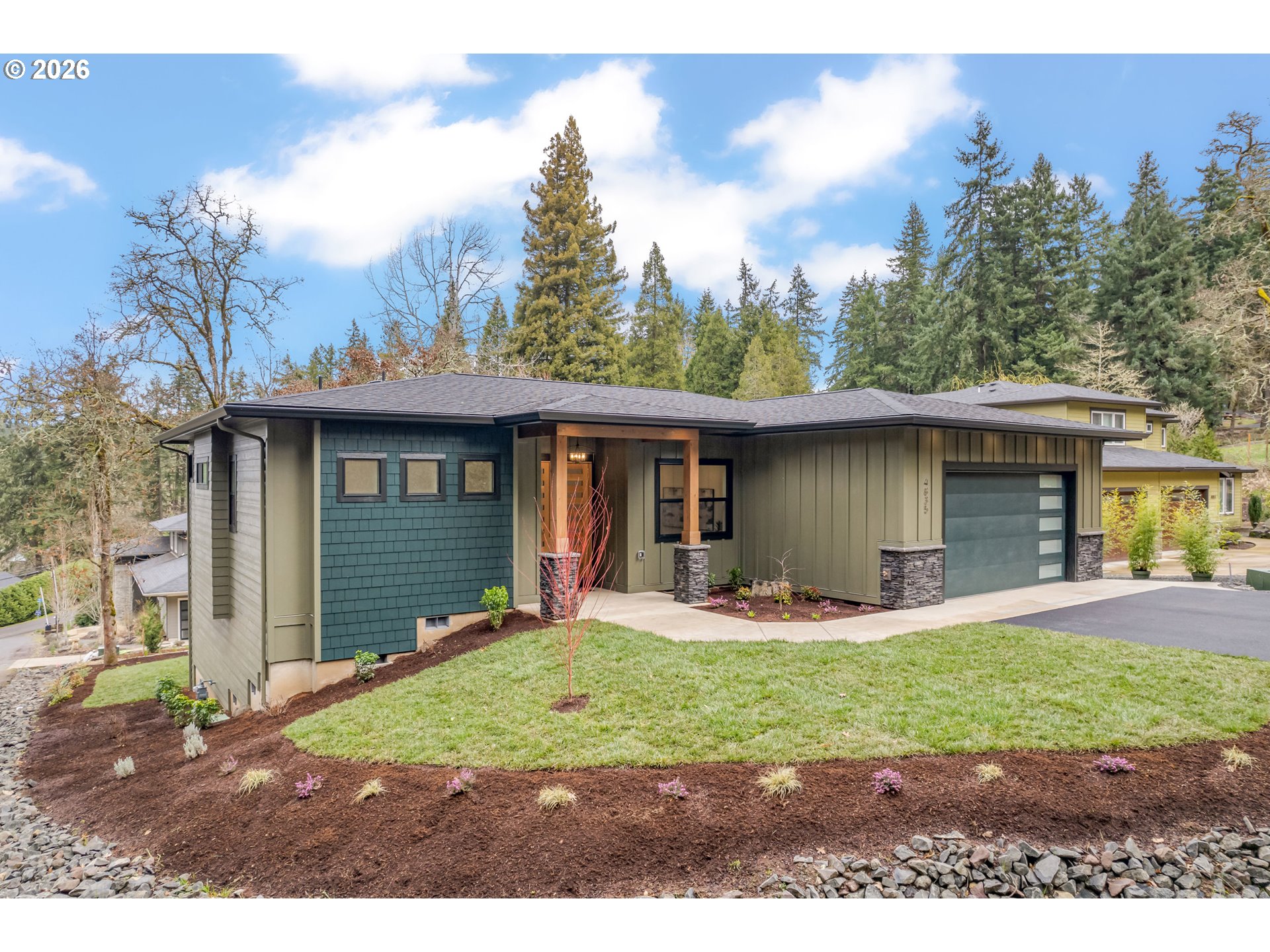 4835 Elva Lane Eugene, OR 97405 - Photo 2 of 48 a front view of a house with garden