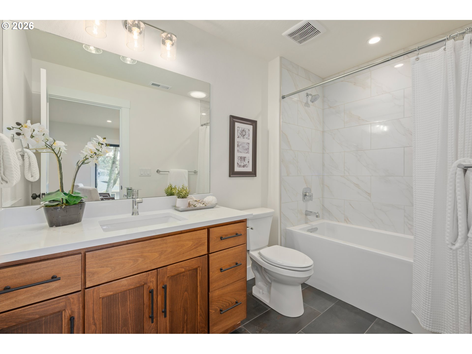 4835 Elva Lane Eugene, OR 97405 - Photo 33 of 48 a bathroom with a double vanity sink toilet and shower
