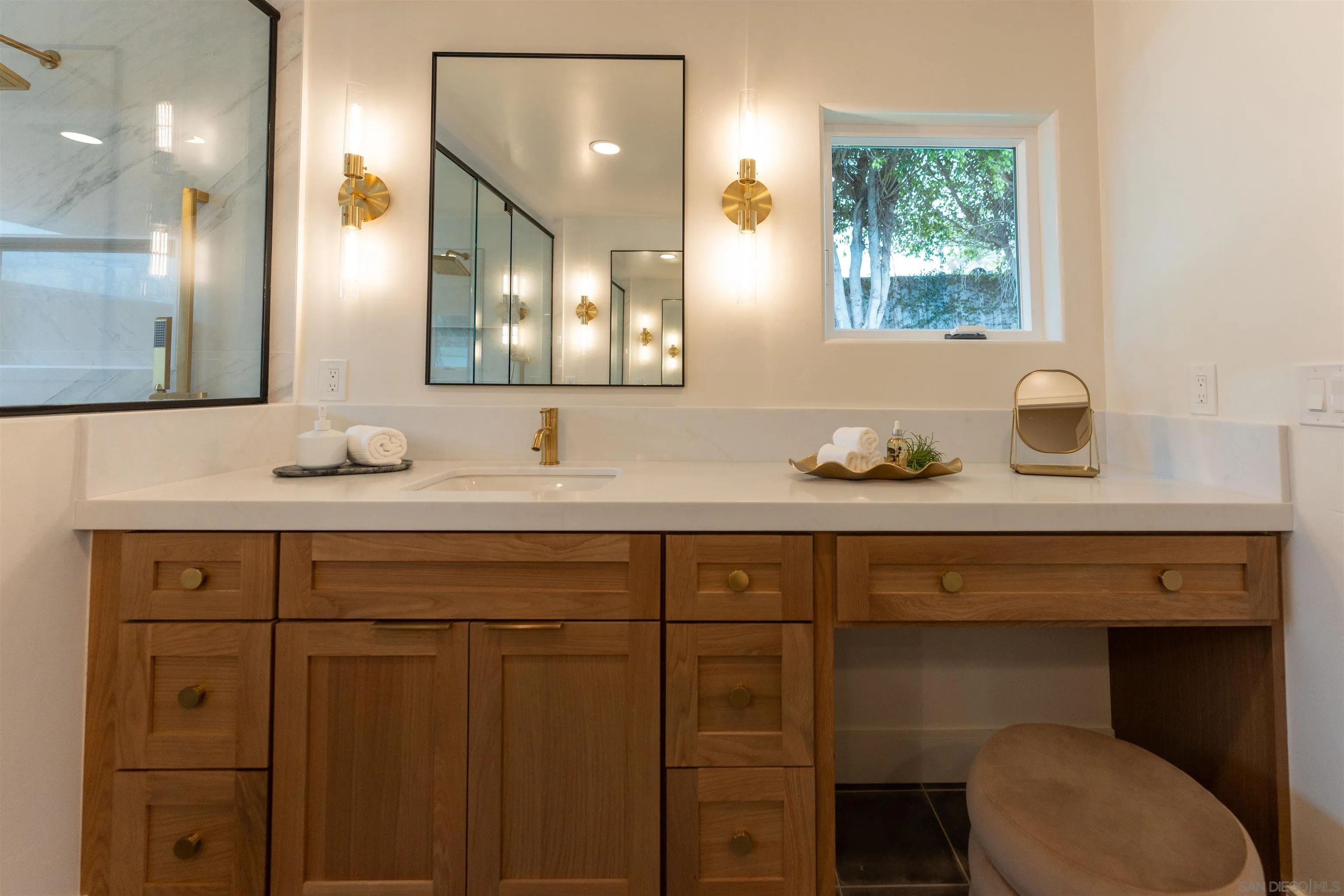 614 Ezee Street Encinitas, CA 92024 - Photo 12 of 46 a bathroom with a sink and a mirror