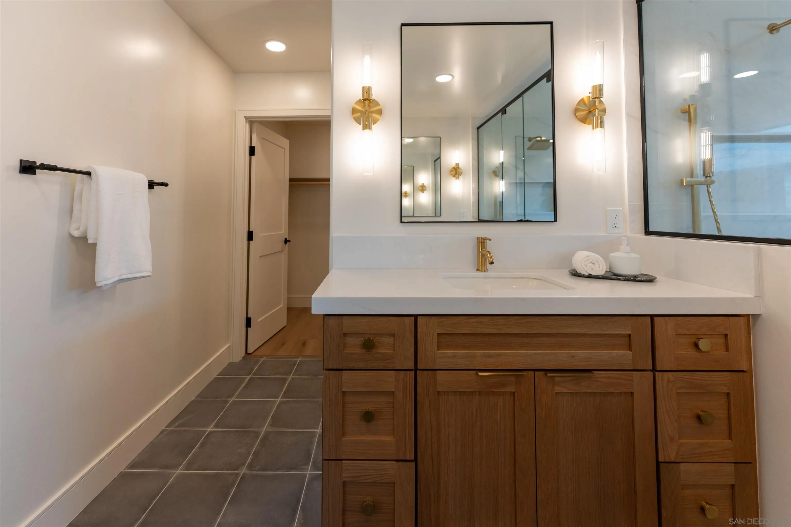 614 Ezee Street Encinitas, CA 92024 - Photo 13 of 46 a bathroom with a sink and a mirror