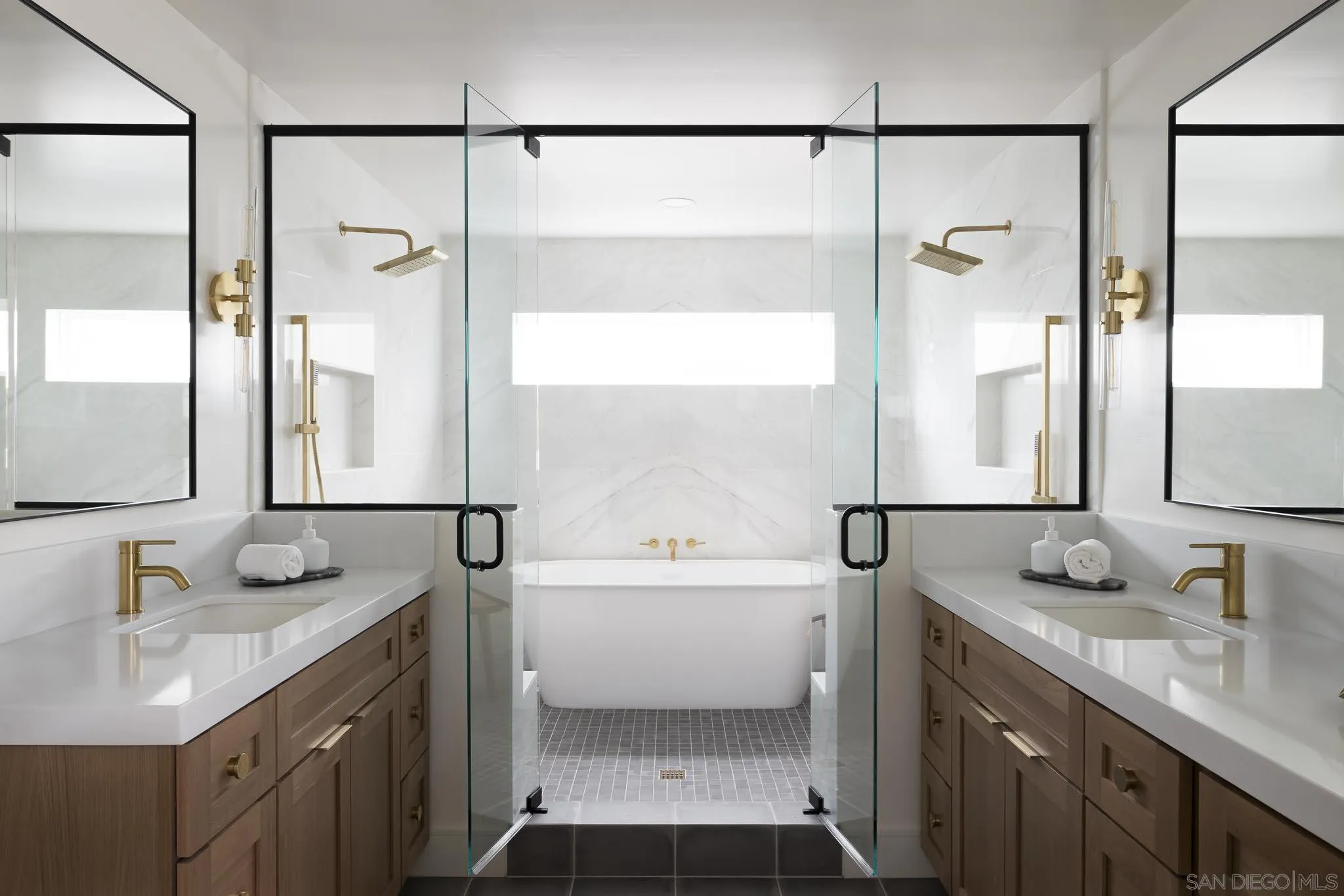 614 Ezee Street Encinitas, CA 92024 - Photo 14 of 46 a bathroom with a sink and a mirror a bathtub