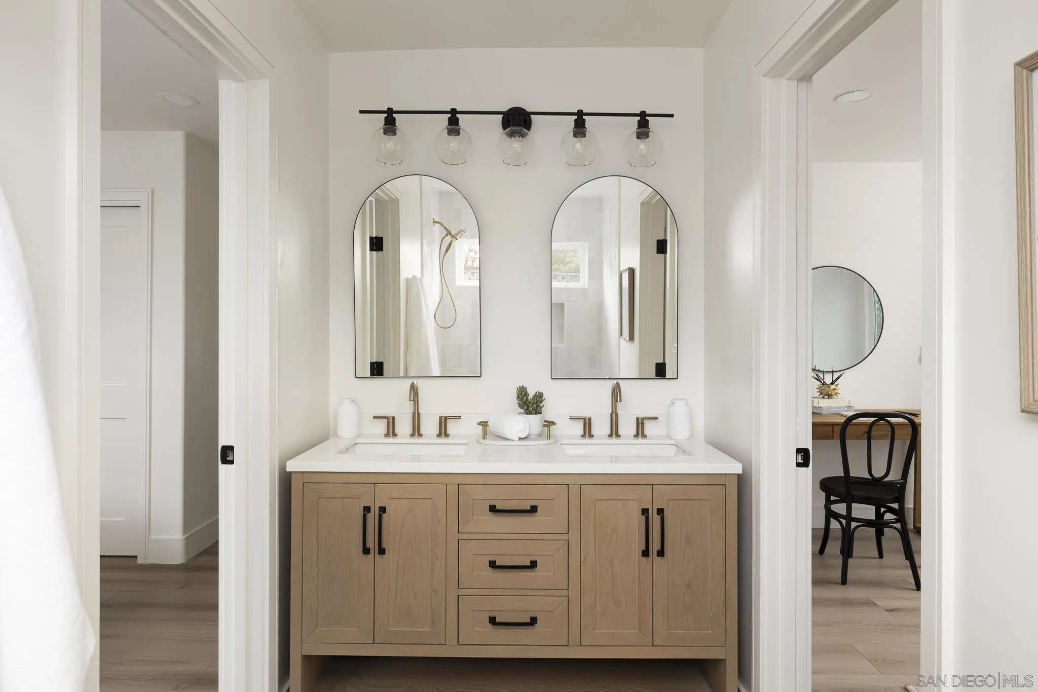 614 Ezee Street Encinitas, CA 92024 - Photo 17 of 46 a bathroom with double vanity sinks and a mirror