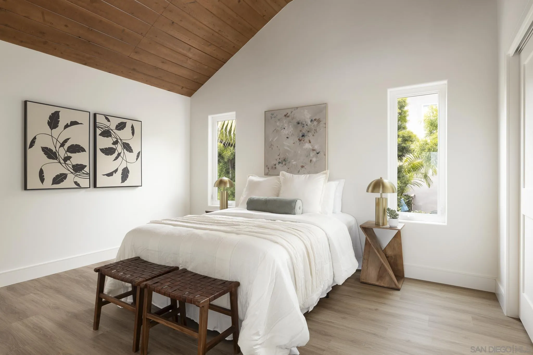 614 Ezee Street Encinitas, CA 92024 - Photo 32 of 46 a bedroom with a bed and a table in it with window