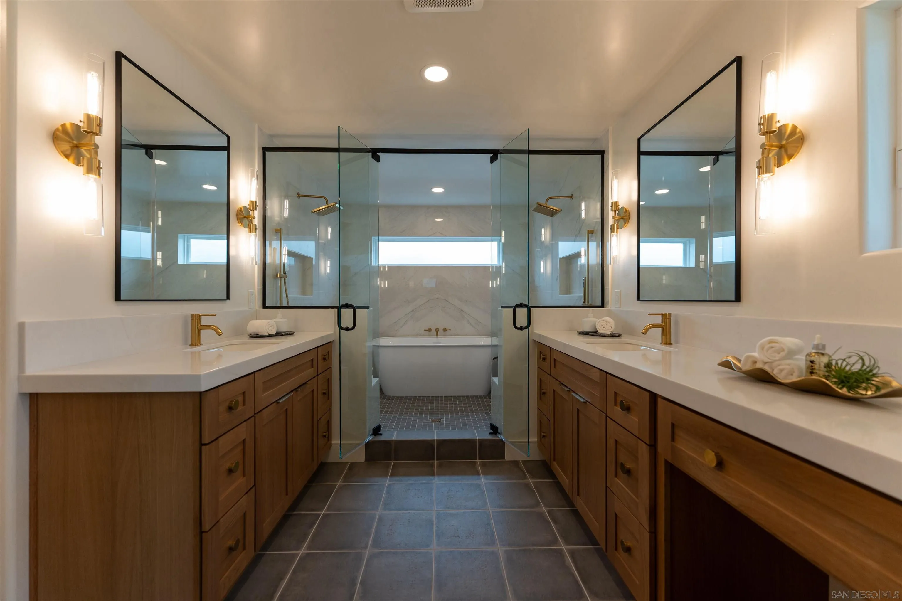 614 Ezee Street Encinitas, CA 92024 - Photo 10 of 46 a bathroom with a double vanity sink mirror and bathtub