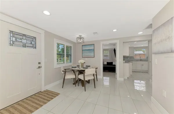a dining room with furniture and window