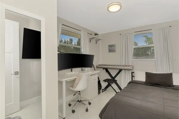 a view of a livingroom with furniture and a flat screen tv