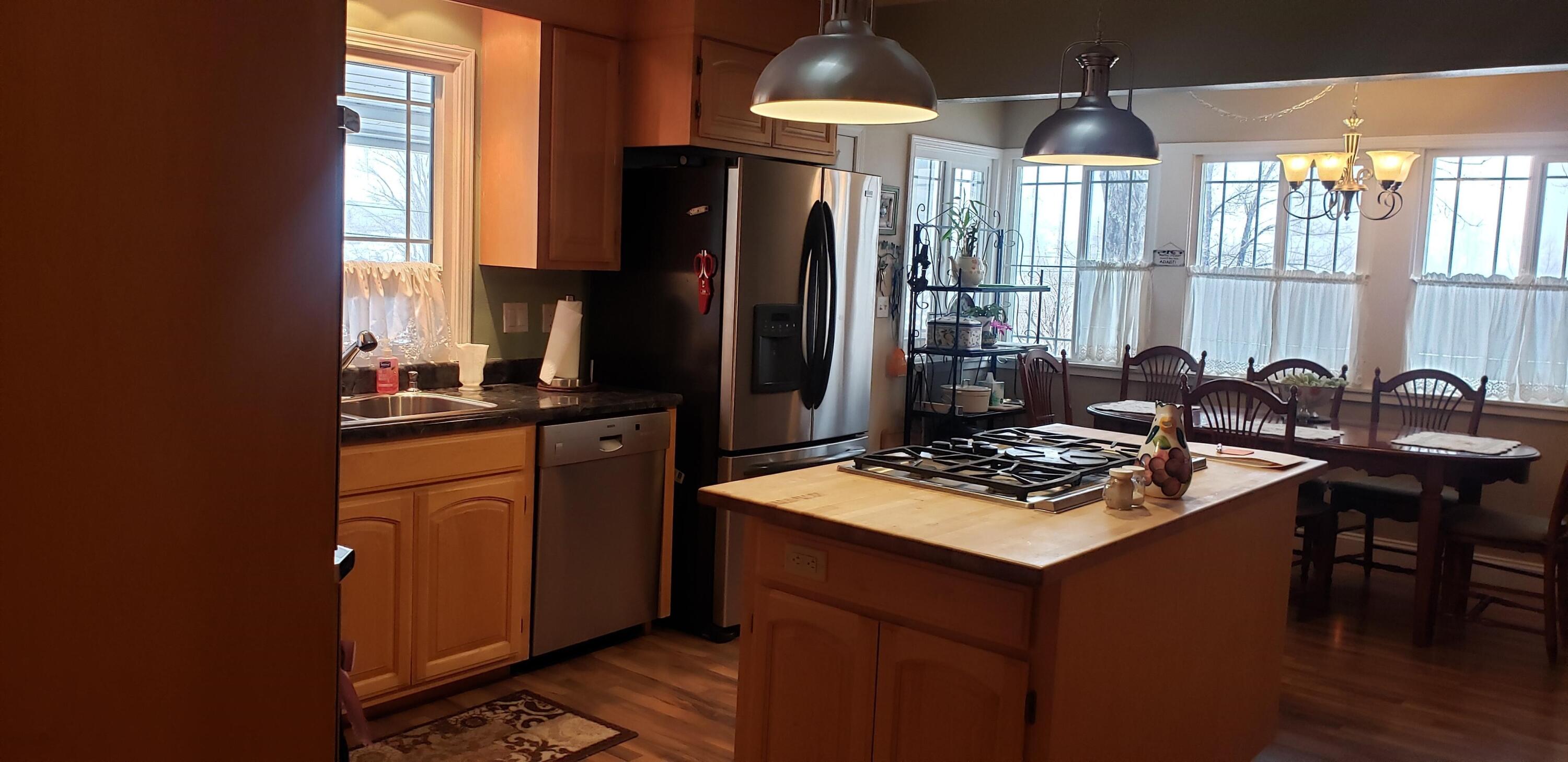 24924 Curve Street Fall River Mills, CA 96028 - Photo 1 of 25 a kitchen with stainless steel appliances granite countertop a sink stove and refrigerator