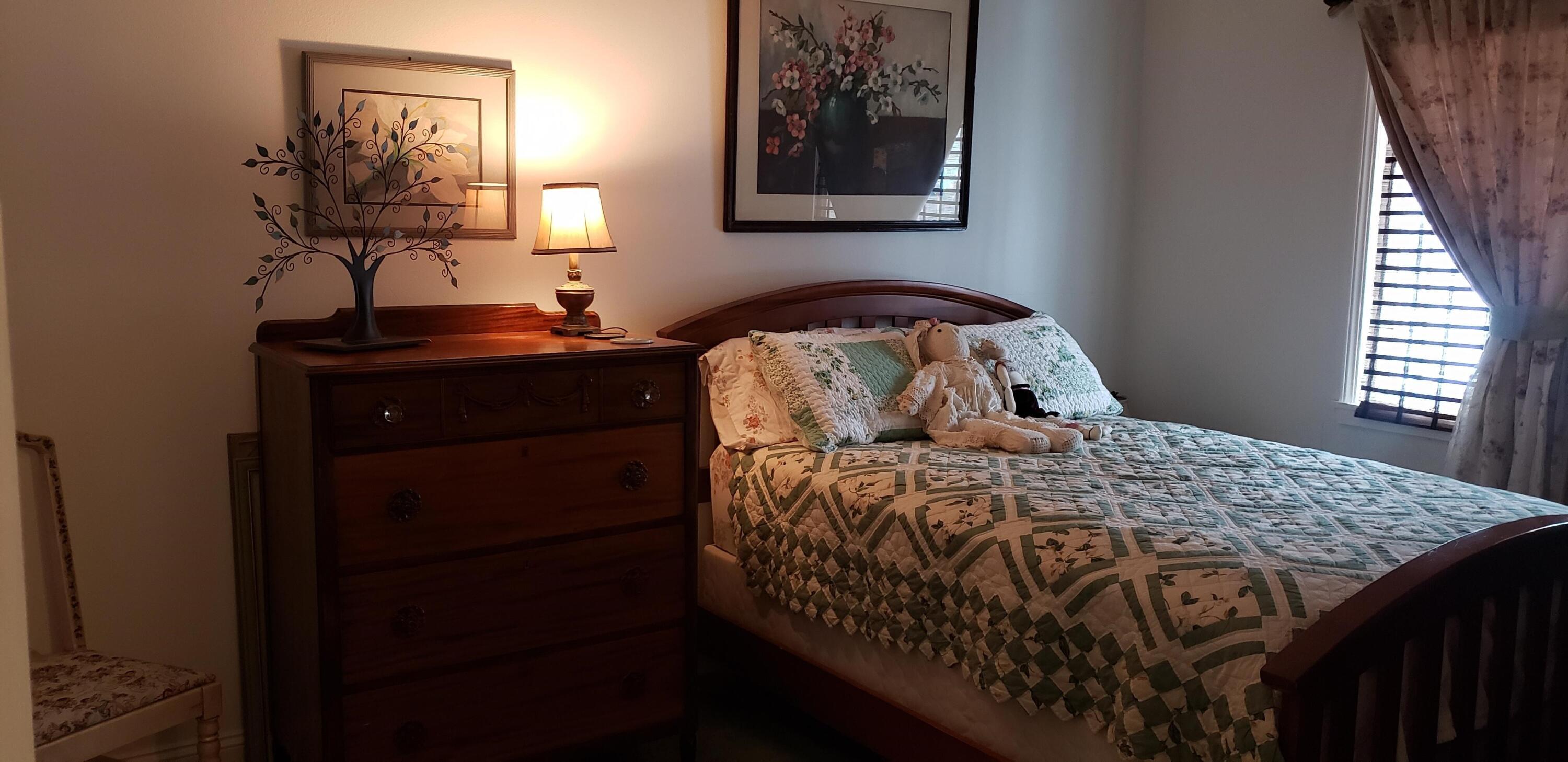24924 Curve Street Fall River Mills, CA 96028 - Photo 11 of 25 a bedroom with a bed and a dresser