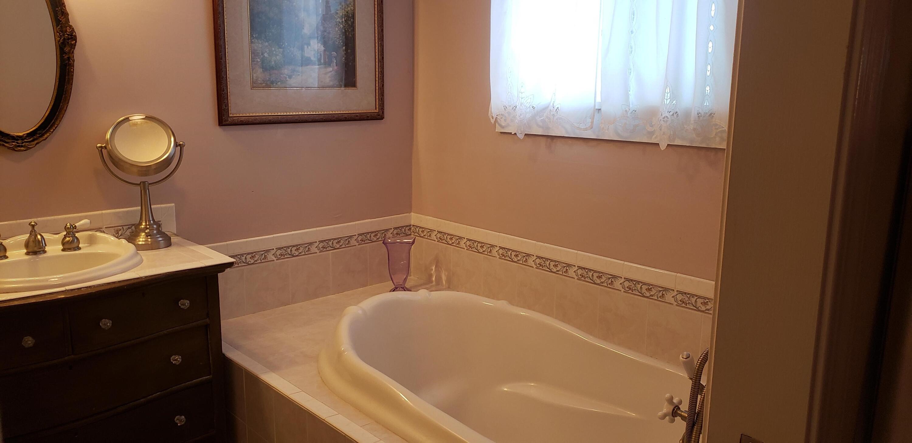24924 Curve Street Fall River Mills, CA 96028 - Photo 16 of 25 a bathroom with a sink and a mirror