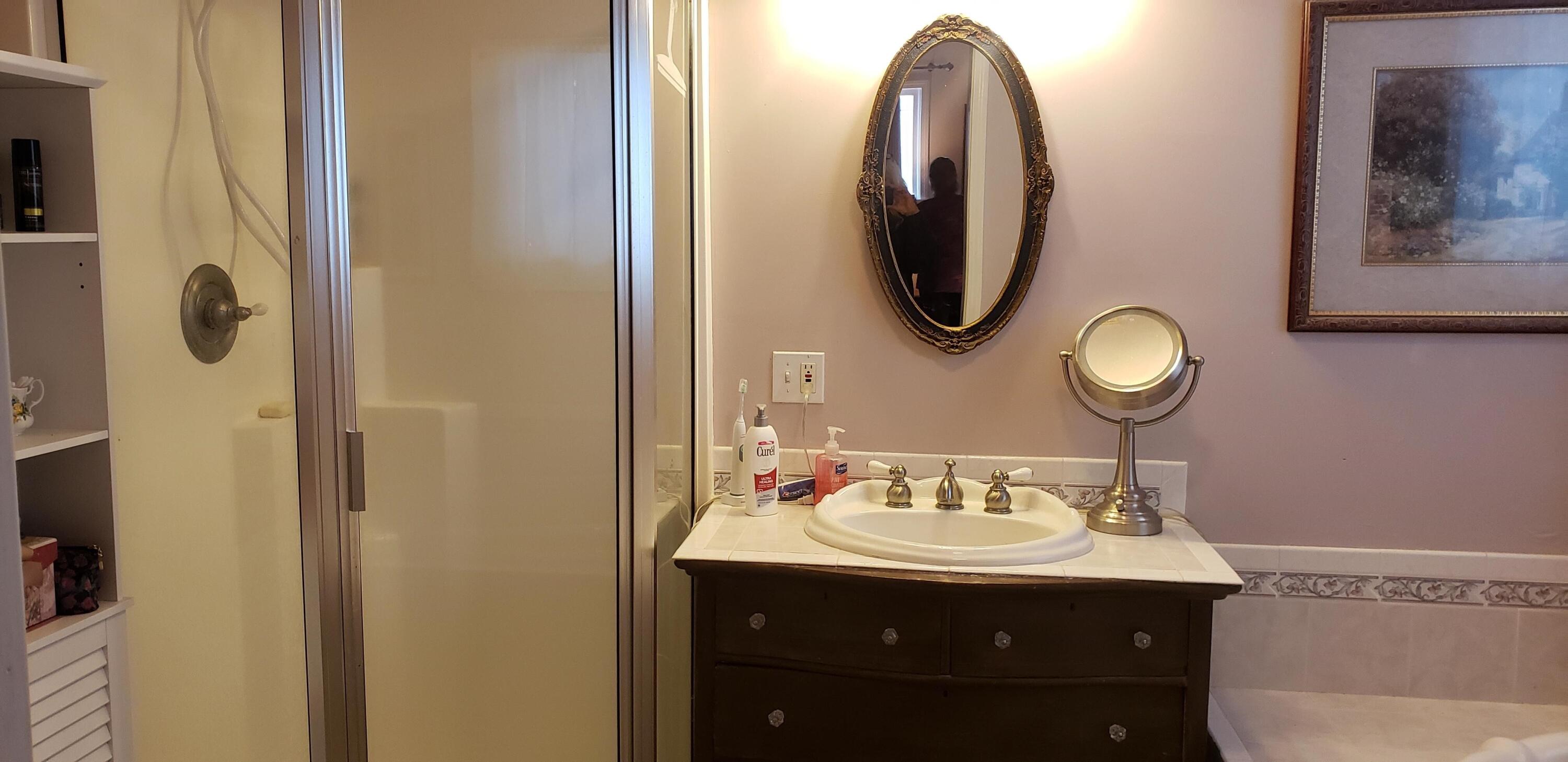 24924 Curve Street Fall River Mills, CA 96028 - Photo 17 of 25 a bathroom with a sink and a mirror
