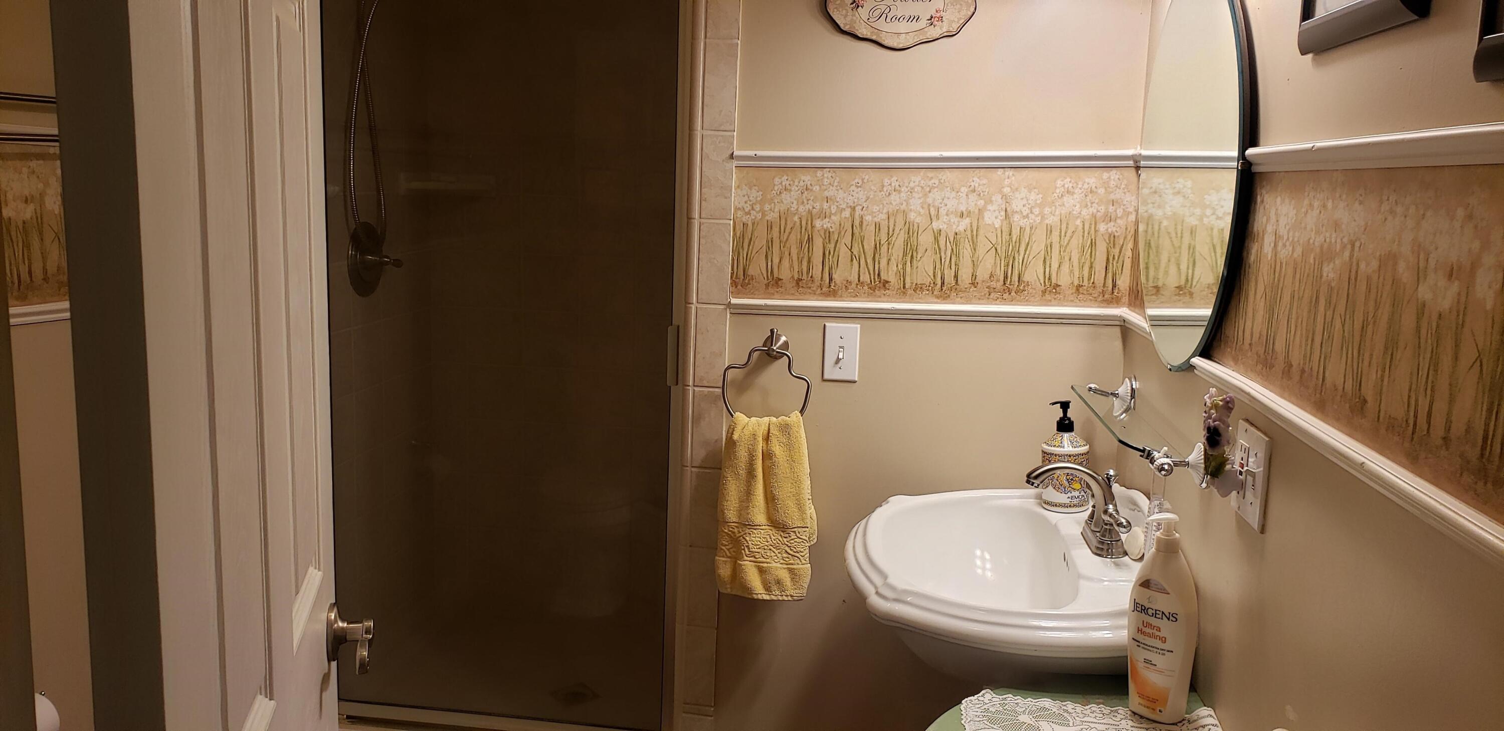 24924 Curve Street Fall River Mills, CA 96028 - Photo 5 of 25 a bathroom with a sink a toilet and shower