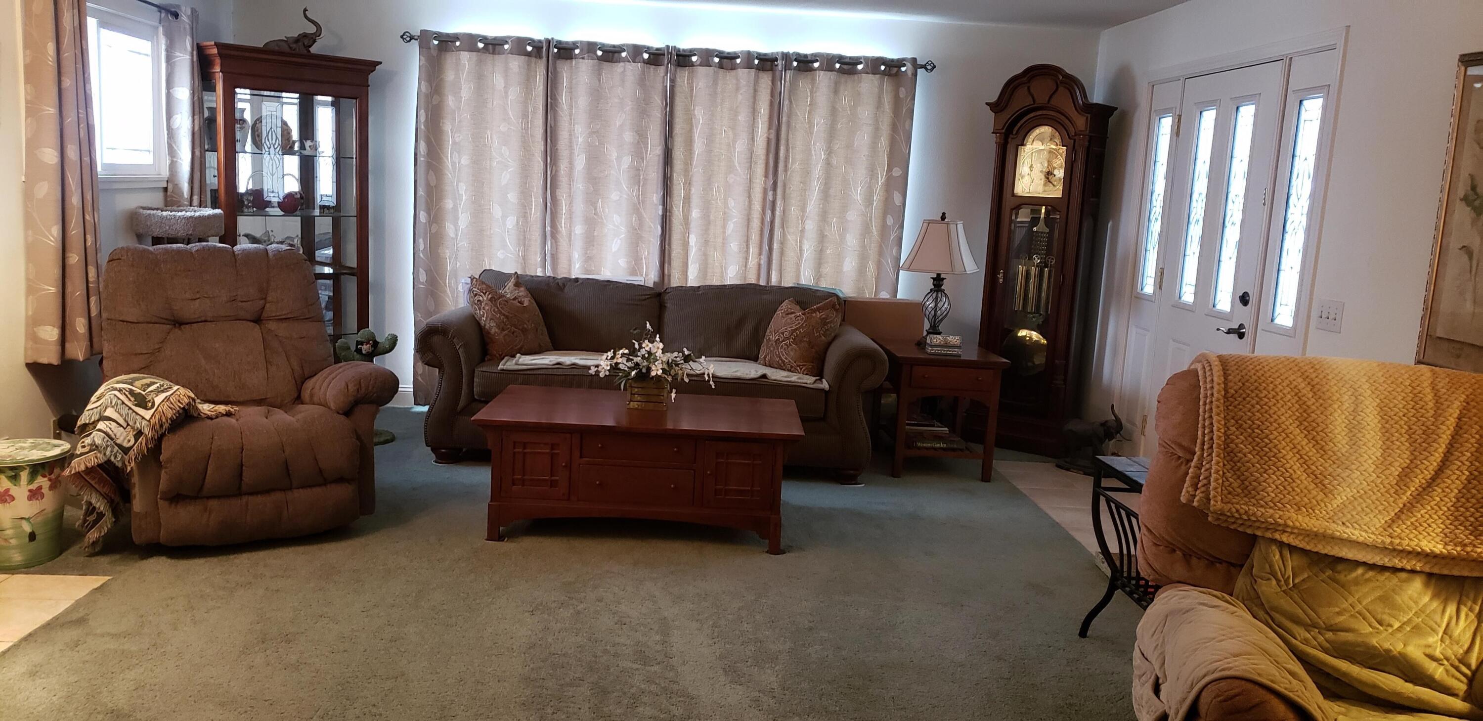 24924 Curve Street Fall River Mills, CA 96028 - Photo 8 of 25 a living room with furniture and a window