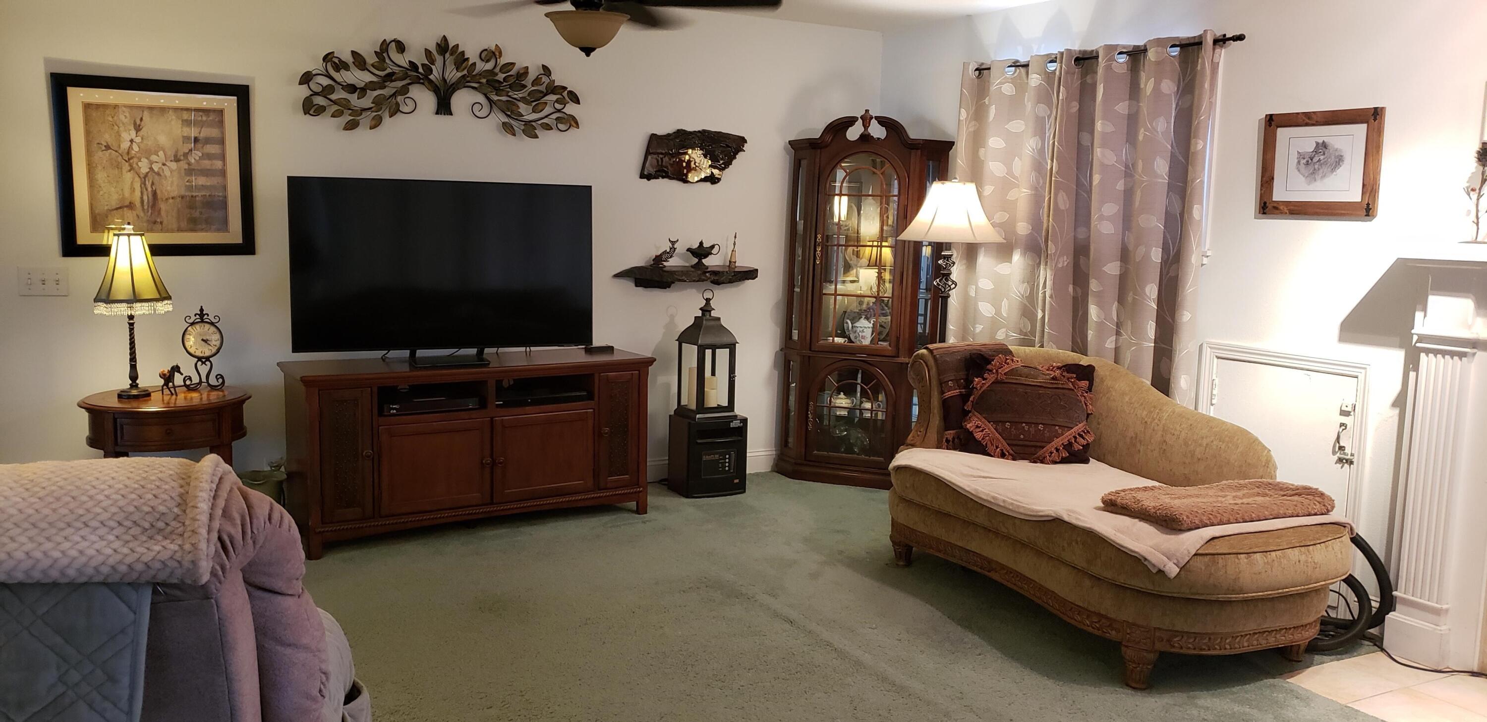 24924 Curve Street Fall River Mills, CA 96028 - Photo 9 of 25 a living room with furniture and a flat screen tv