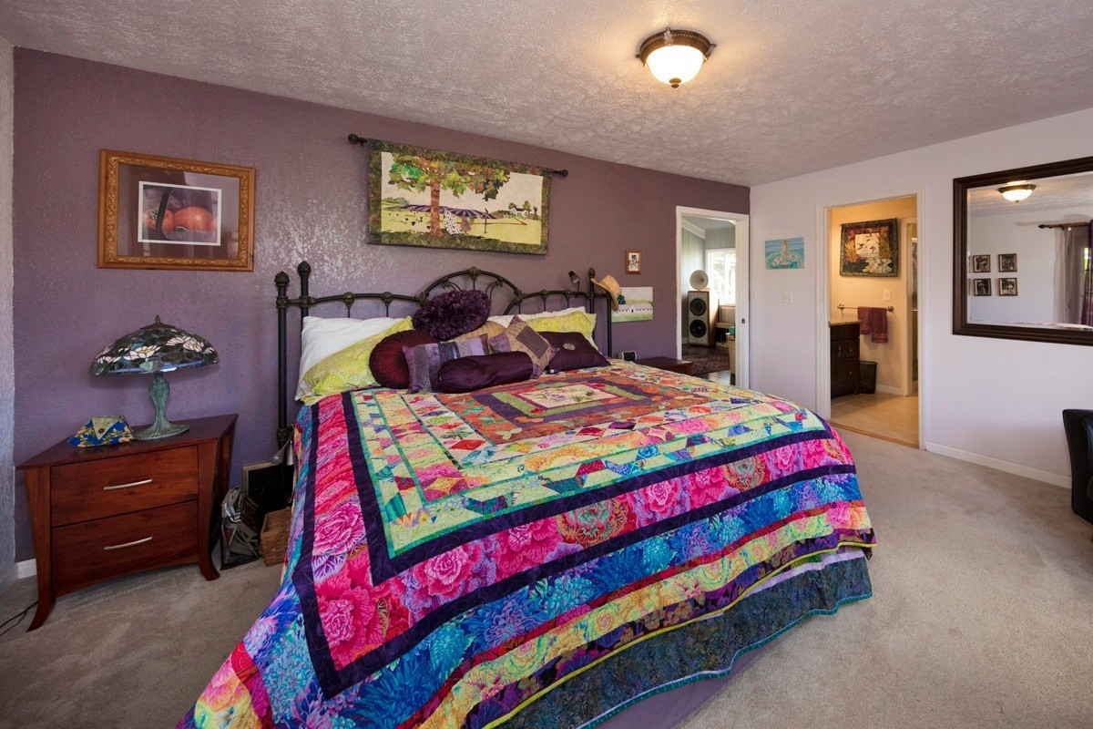 20 Hoaka Road Hilo, HI 96720 - Photo 9 of 30 a bedroom with a bed and dresser