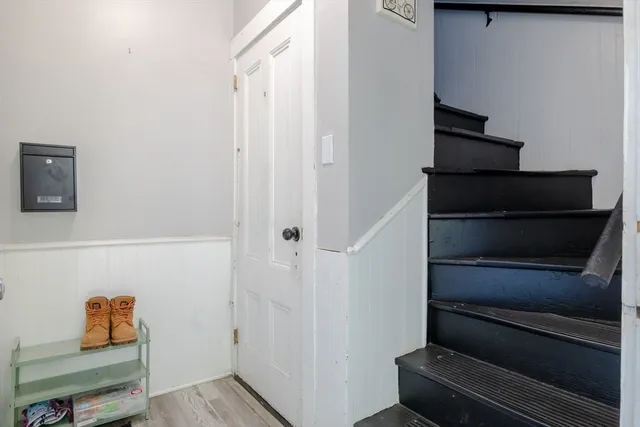 a kitchen with white cabinets and appliances