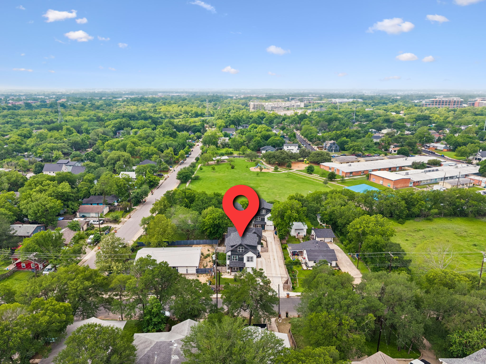 5305 Ledesma Road, Unit 1 Austin, TX 78721 - Photo 25 of 26 Aerial perspective showcasing the property's location within a verdant neighborhood