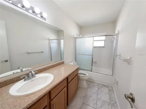 a view of an empty room with a windows