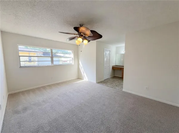 a view of an empty room with a window