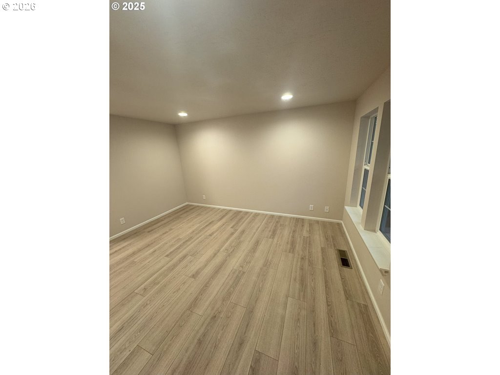 529 Helen Street Eugene, OR 97404 - Photo 7 of 9 a view of hallway with wooden floor