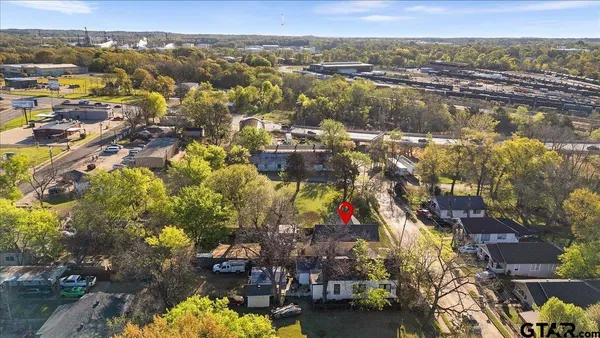 an aerial view of residential houses with outdoor space