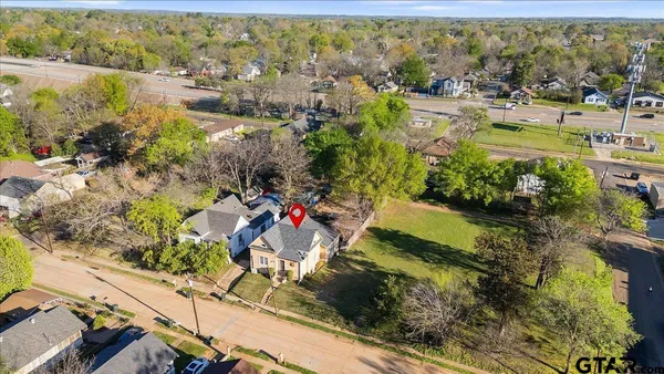 an aerial view of residential houses with outdoor space