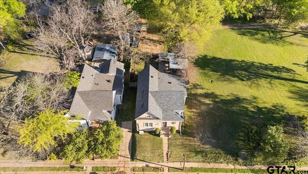 a aerial view of a house with a ocean view