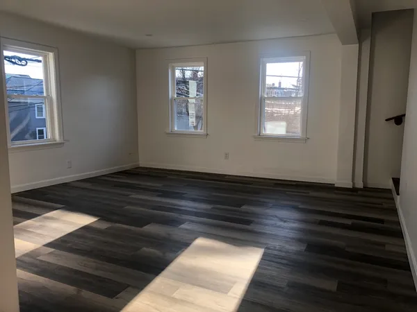 a view of wooden floor in an empty room