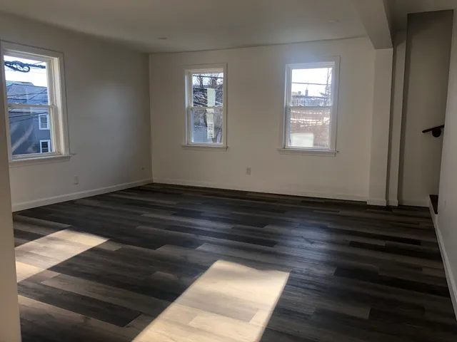 a view of wooden floor in an empty room