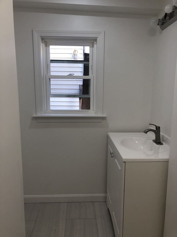 57 Bloomingdale Street, Unit 1 Chelsea, MA 02150 - Photo 4 of 9 a utility room with a window