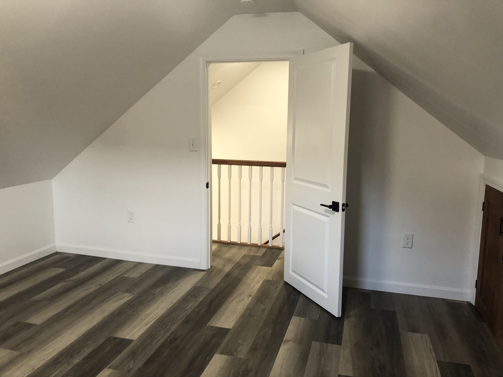 57 Bloomingdale Street, Unit 1 Chelsea, MA 02150 - Photo 9 of 9 a view of a room with wooden floor and a window