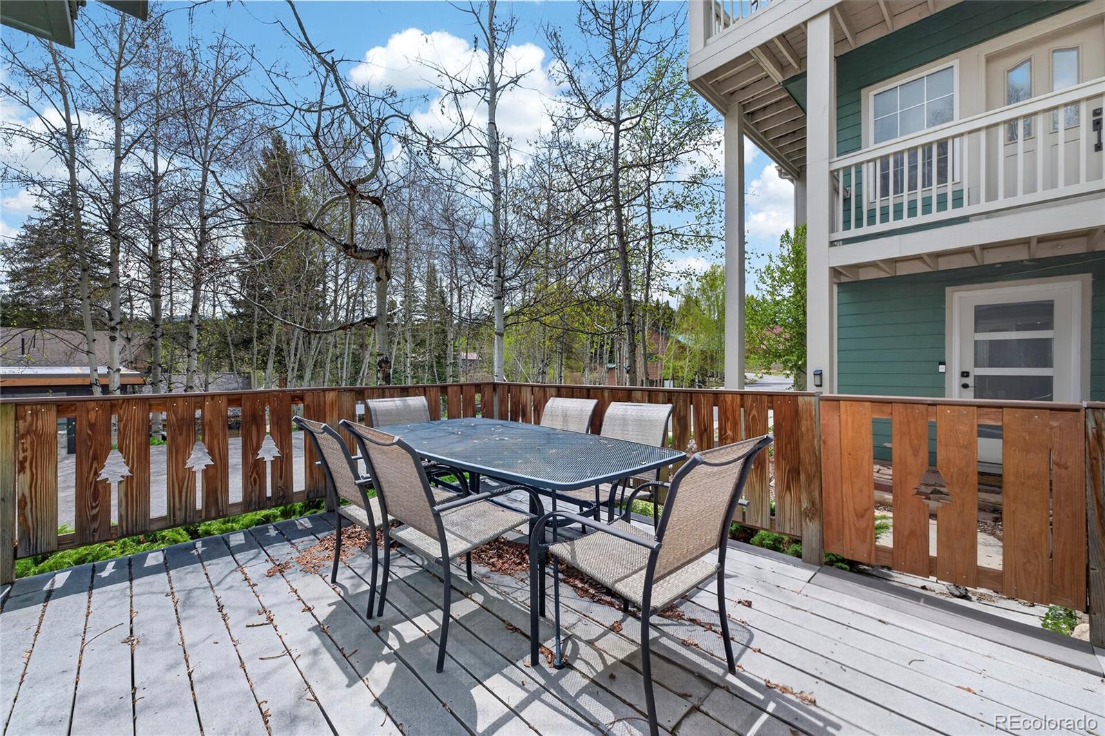 327 Vasquez Road, Unit E1 Winter Park, CO 80482 - Photo 16 of 43 a view of backyard with a deck and furniture