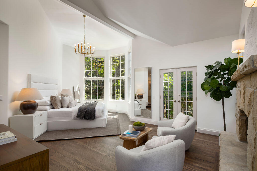1839 East Mountain Drive Montecito, CA 93108 - Photo 12 of 24 a living room with furniture potted plant and a large window