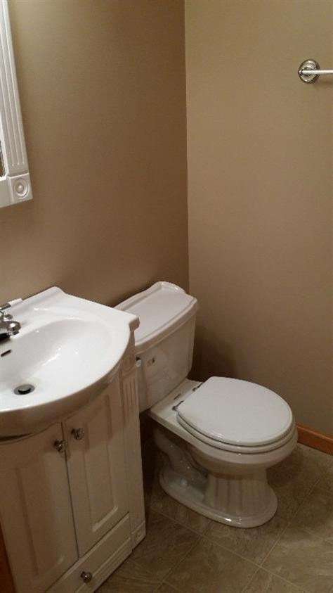 75 South Smoke Road Kouts, IN 46347 - Photo 3 of 10 a white toilet sitting next to a bathroom sink