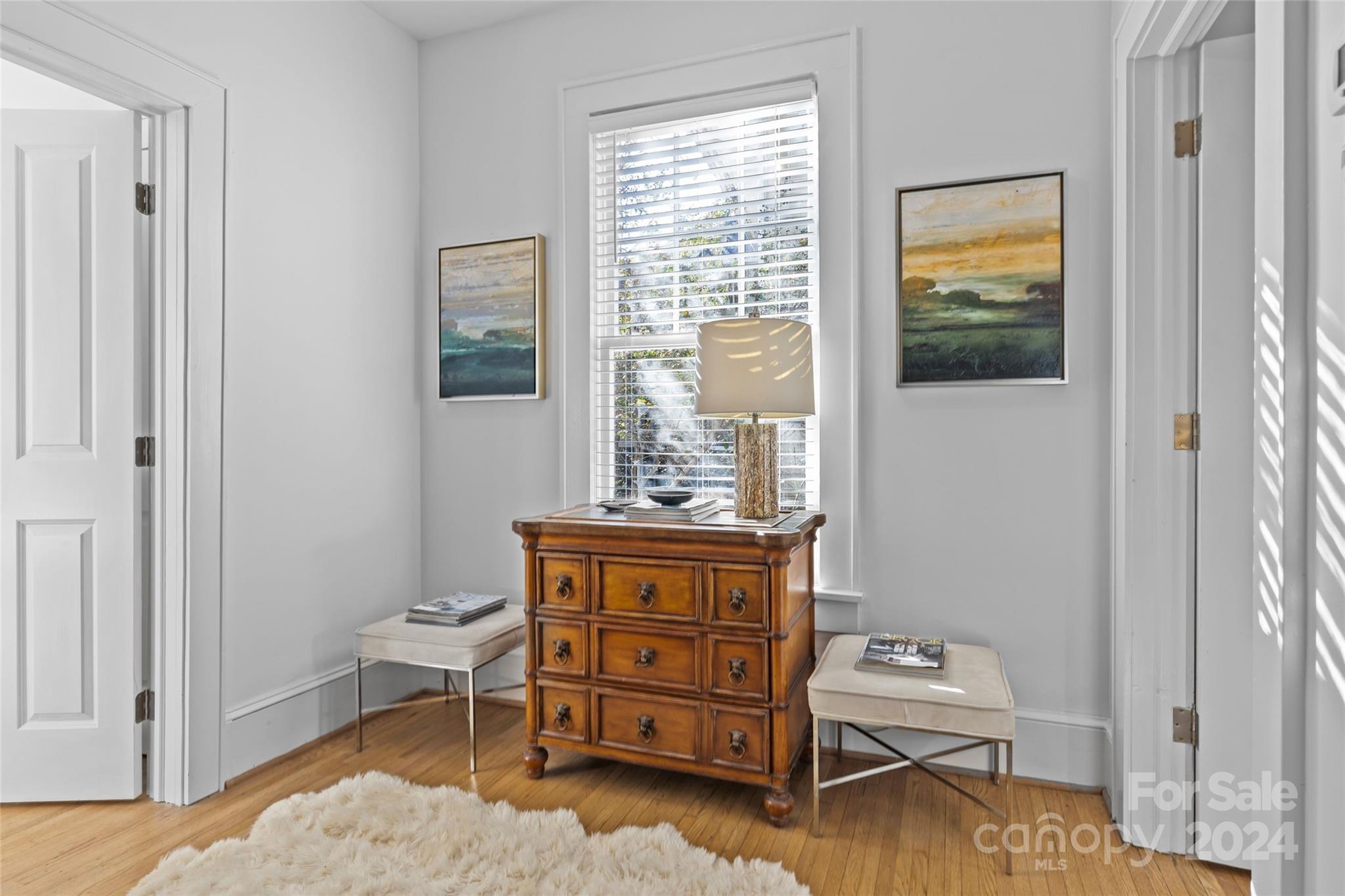 609 Queens Road, Unit A Charlotte, NC 28207 - Photo 15 of 33 a room with a dresser and a window