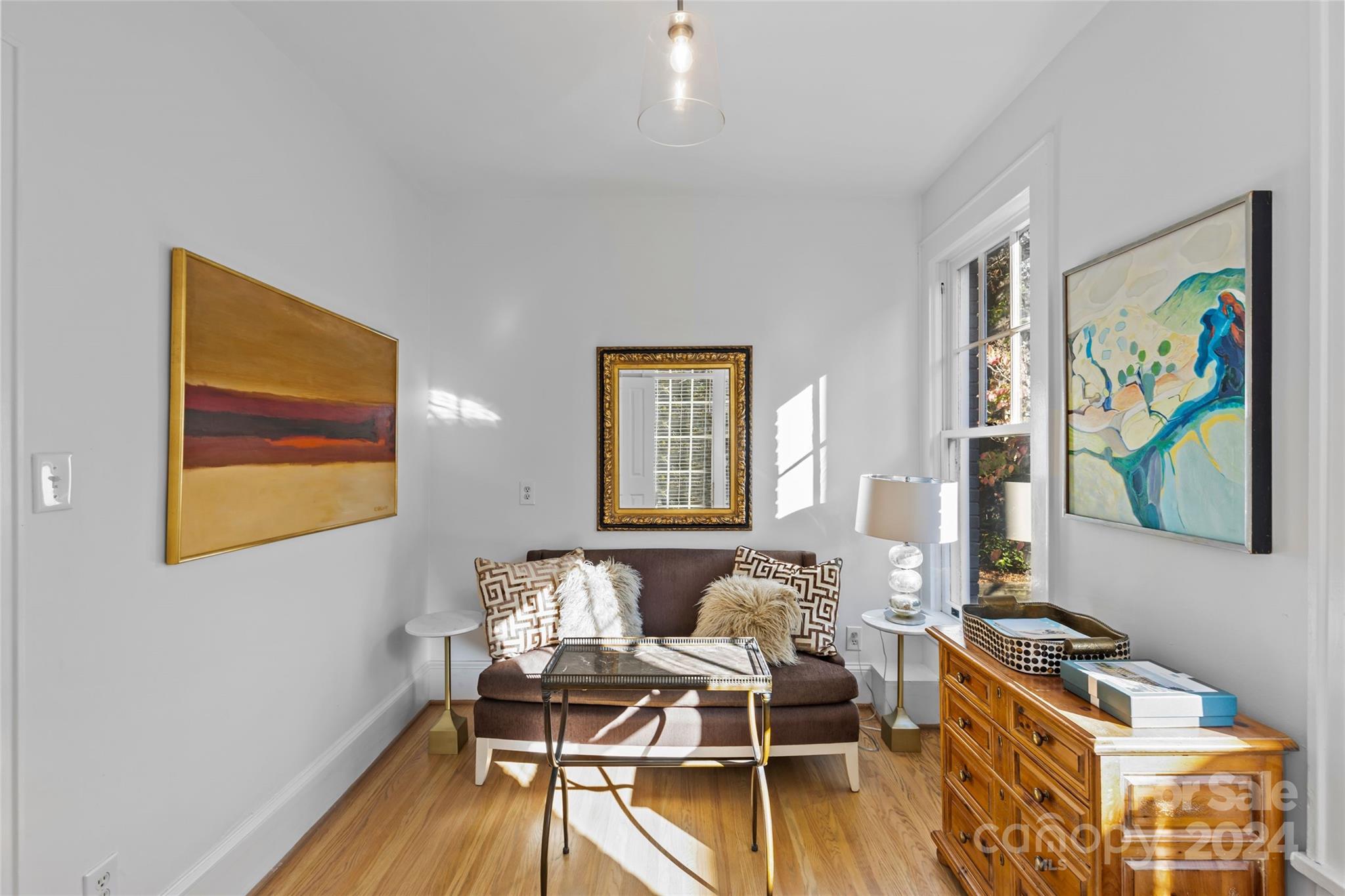 609 Queens Road, Unit A Charlotte, NC 28207 - Photo 23 of 33 a living room with furniture and a wooden floor