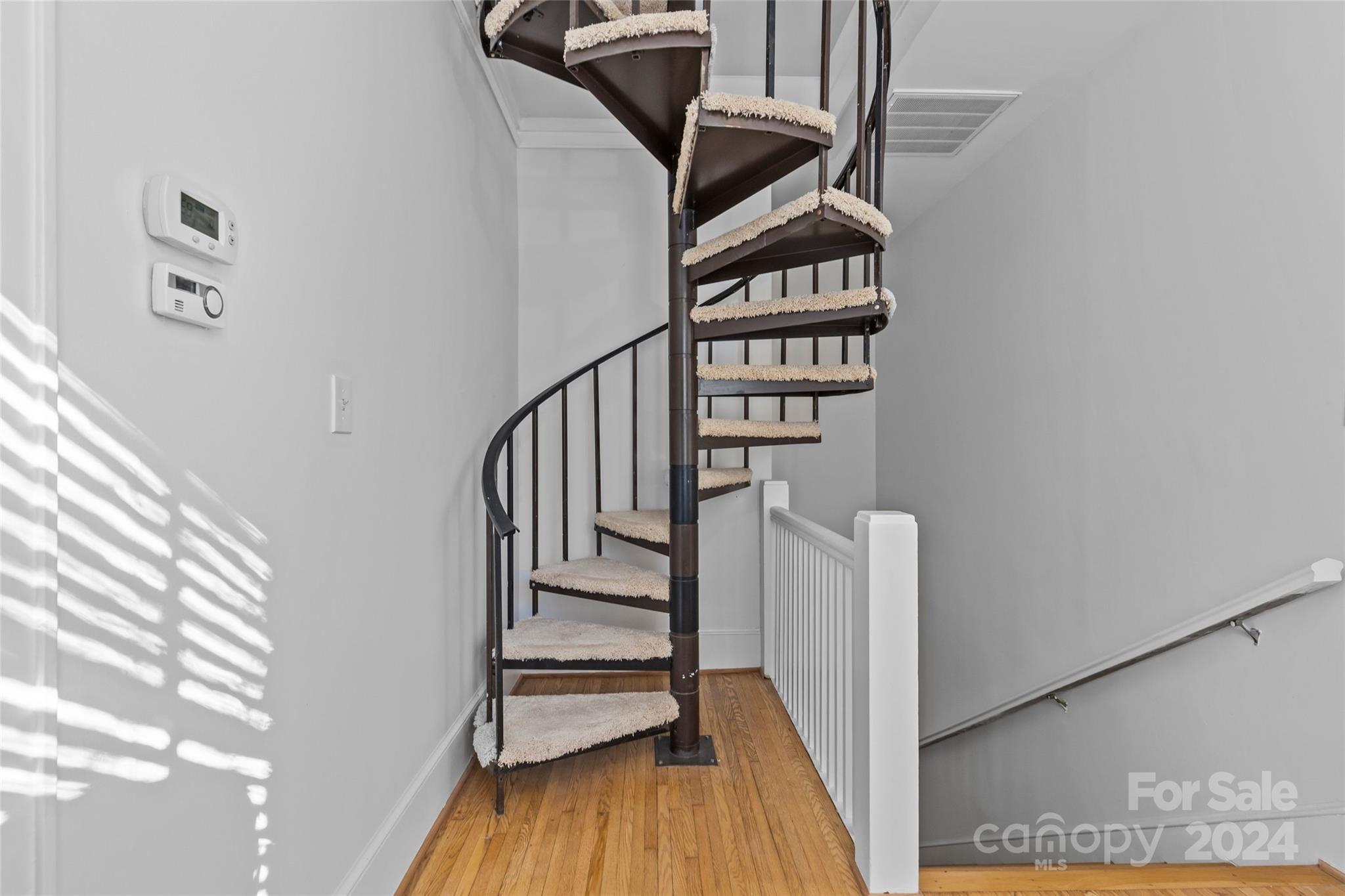 609 Queens Road, Unit A Charlotte, NC 28207 - Photo 25 of 33 a view of entryway with wooden floor