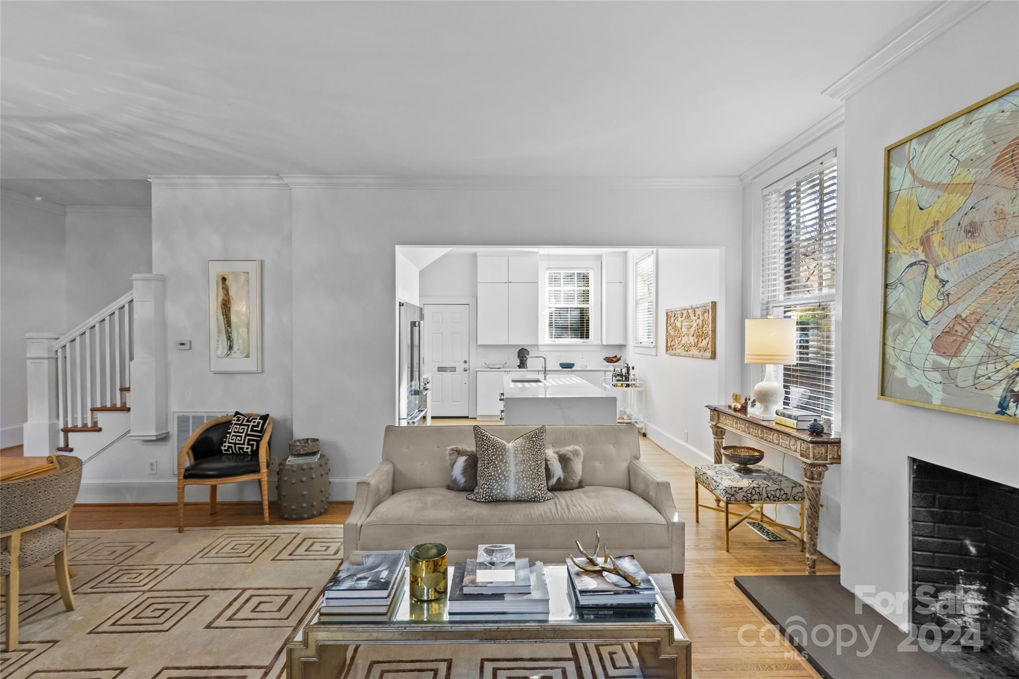 609 Queens Road, Unit A Charlotte, NC 28207 - Photo 10 of 33 a living room with furniture and a fireplace