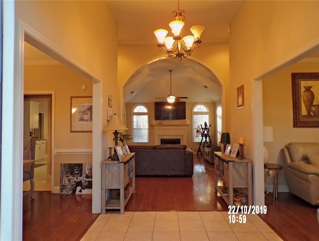 1035 Upchurch Road McDonough, GA 30252 - Photo 23 of 48 a living room with furniture chandelier and a chandelier