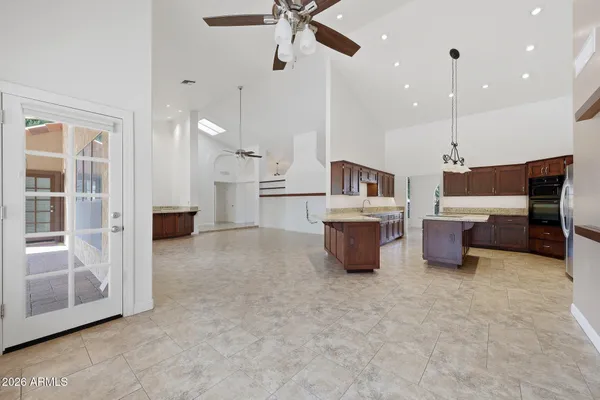 a kitchen with a sink stove and cabinets