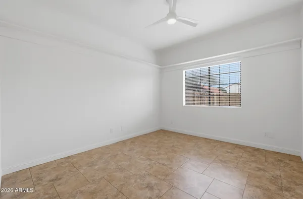 a bathroom with a granite countertop sink mirror and a bathtub