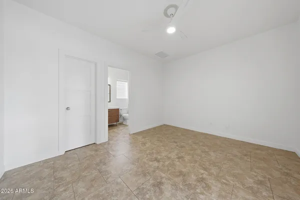 a view of a backyard with large trees