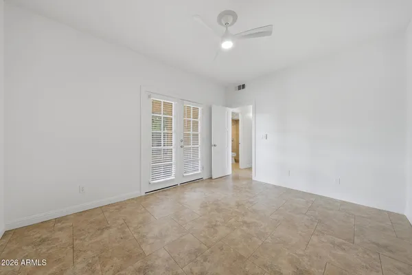 a view of a house with backyard and a tree