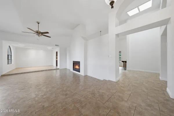 an empty room with windows and entrance