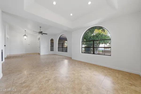 a large kitchen with stainless steel appliances granite countertop a stove and a sink