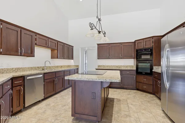 a living room with furniture and a ceiling fan