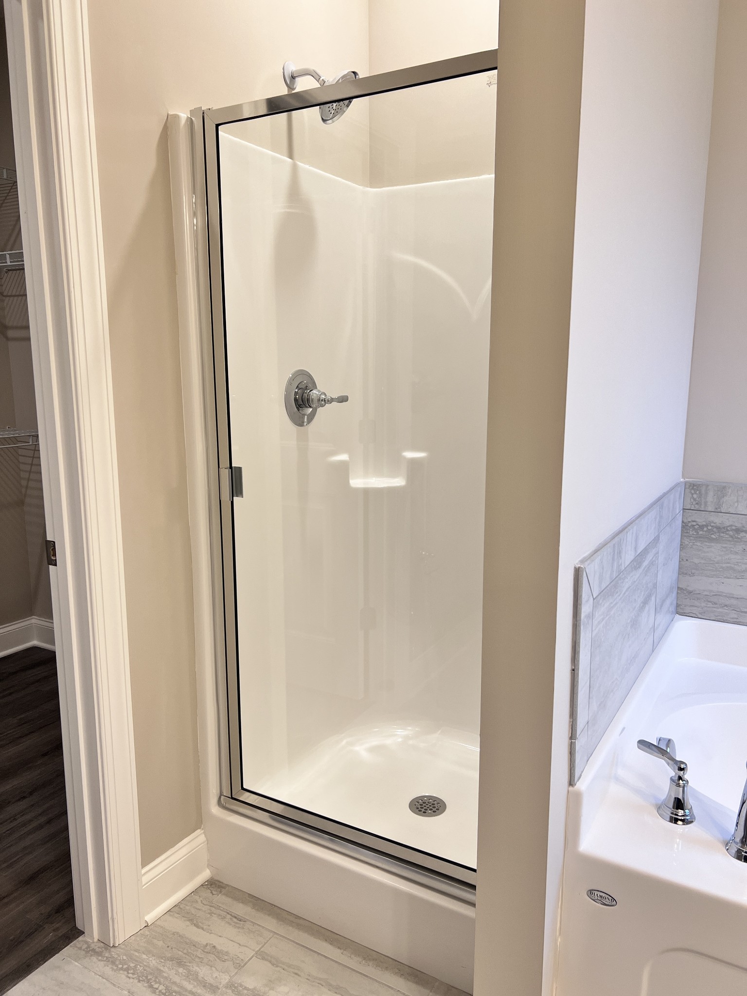 442 Generosity Way Smyrna, TN 37167 - Photo 15 of 59 a bathroom with a glass shower door