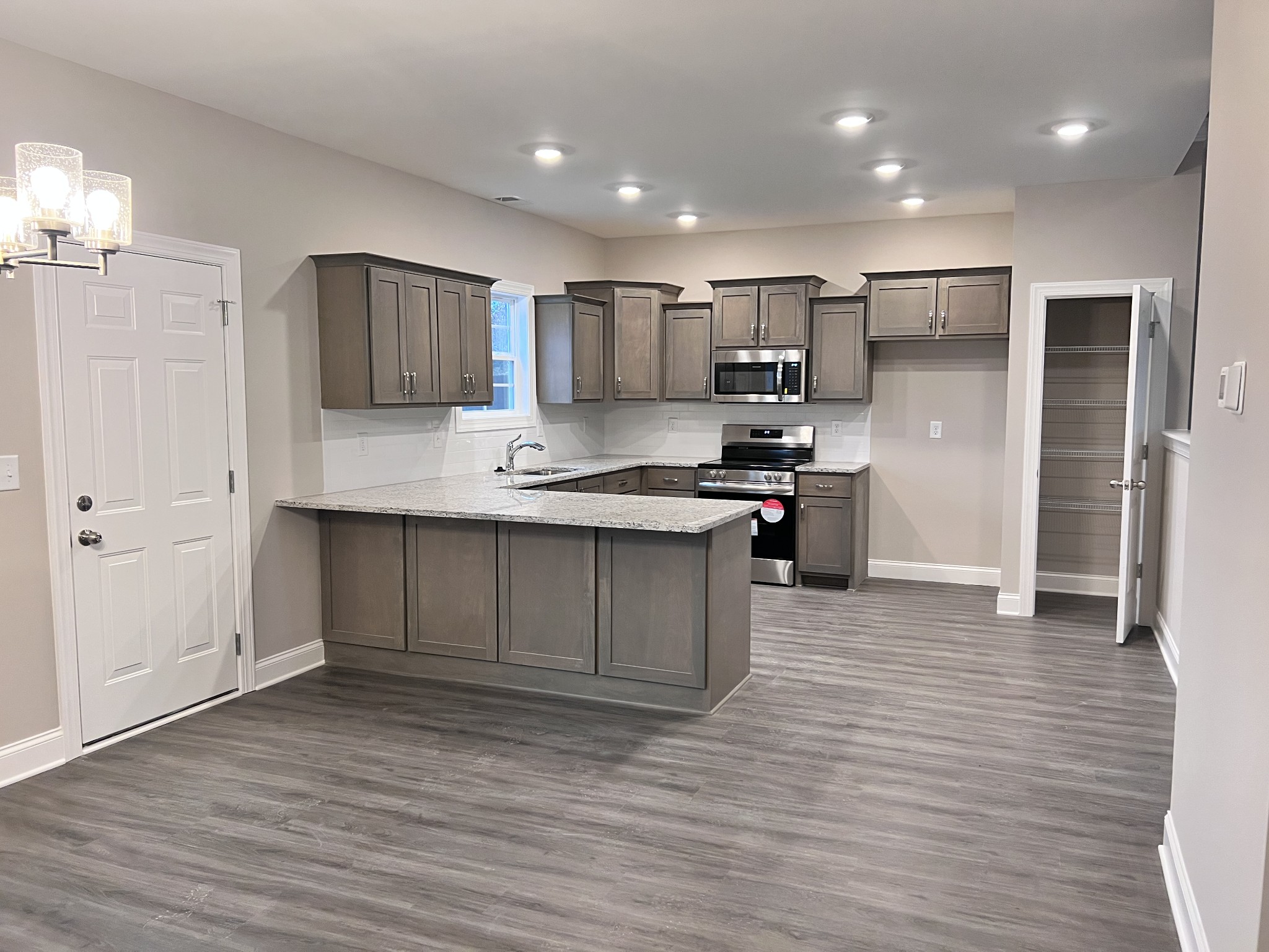 442 Generosity Way Smyrna, TN 37167 - Photo 29 of 59 a kitchen with stainless steel appliances granite countertop a refrigerator and a stove top oven