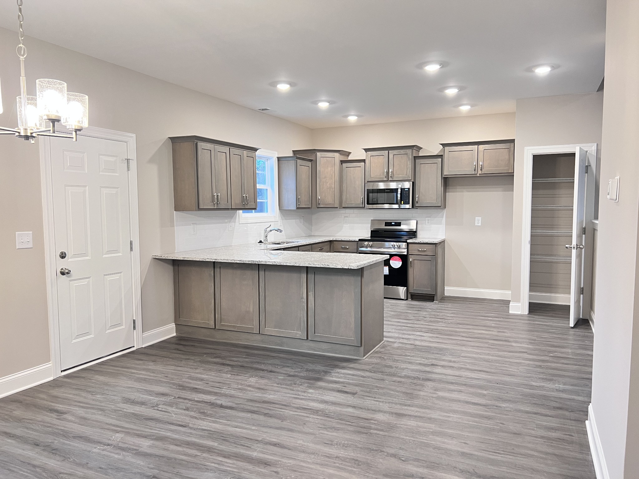 442 Generosity Way Smyrna, TN 37167 - Photo 32 of 59 a kitchen with stainless steel appliances granite countertop a refrigerator and a stove top oven