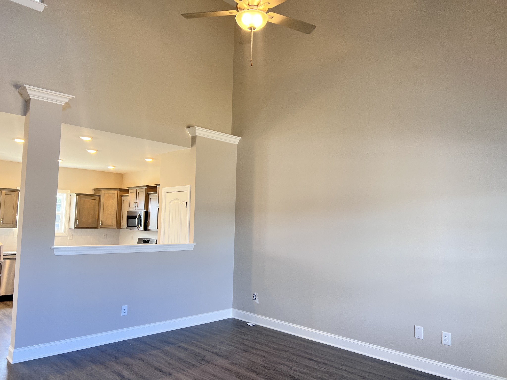 442 Generosity Way Smyrna, TN 37167 - Photo 43 of 59 a view of a kitchen with wooden floor and a chandelier fan